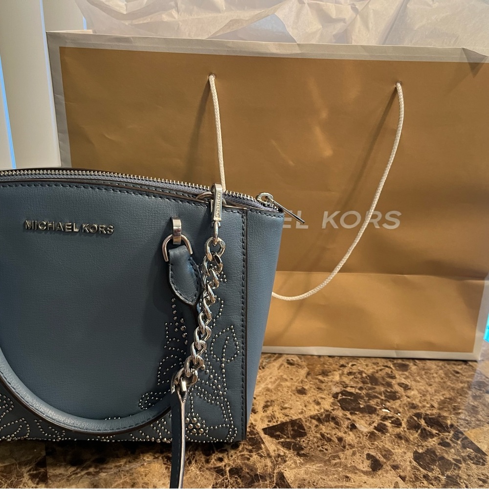 Light blue Micheal Kors purse ,  gently used.  Studded design.